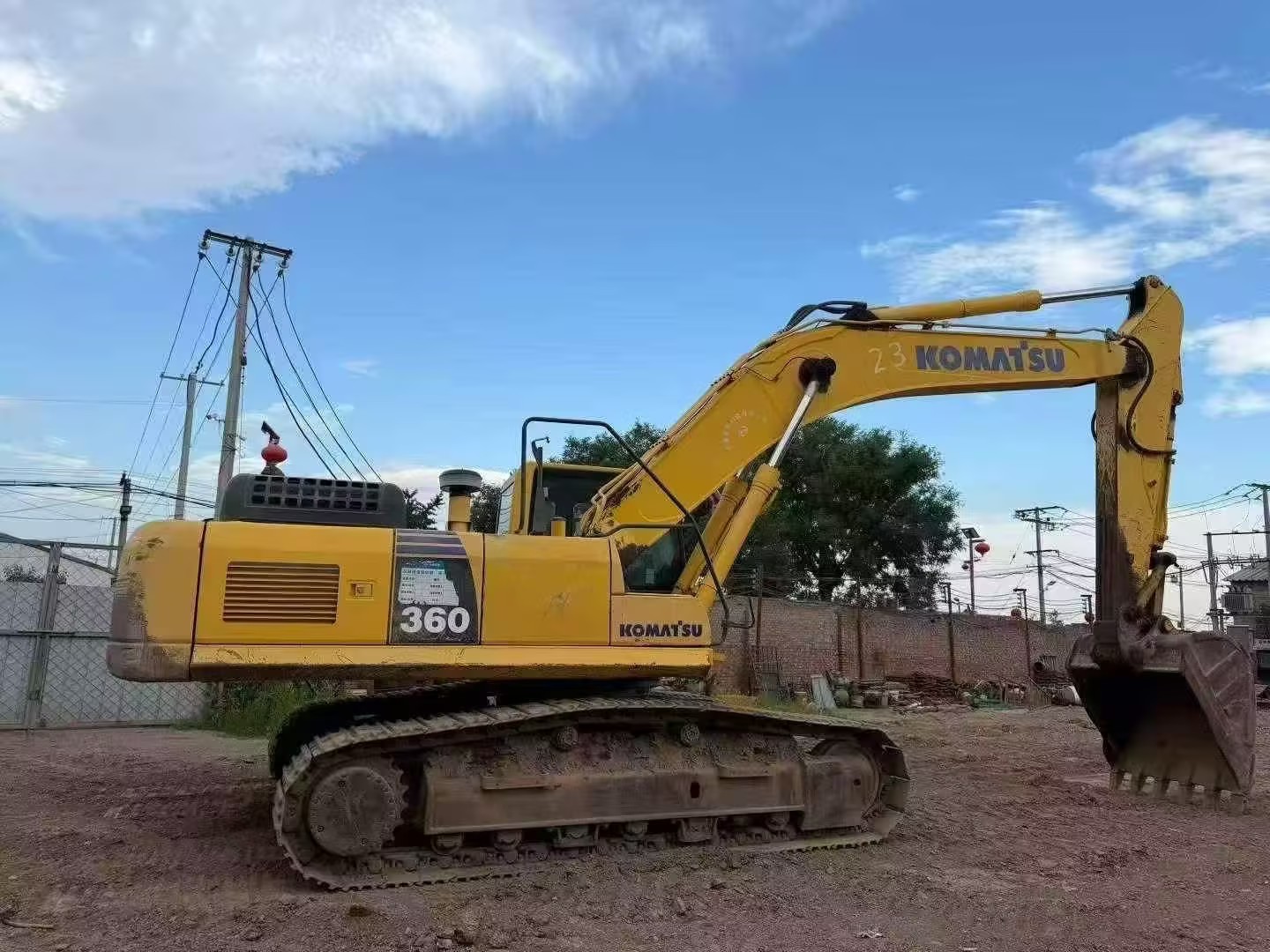 Used excavator inspection photo showing machine structure and components